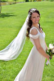 My original (expensive) wedding gown couldn't be altered for my May 30, 2020 wedding, so I found this bridal beauty! Simplistic and totally different than my costly, embellished dress, but I love it just the same! So feminine and lightweight, the material flowed and was comfortable all day. I usually wear a juniors size SMALL or 5/6, but I tried an XS thinking it was roomier than a straight skirt. It fit well in the waist but was too tight in the bust and ribcage (however I am slightly broader across the back). The SMALL fit perfectly above the waist and was only an inch too big at the waist, which I had taken in by a friend and hemmed 2-1/4" to wear with 3" heels. Everyone loved it! - Jennifer F.