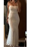 I just instantly fell in love with this dress the moment I put it on. It fits so perfectly like it was made for my body. The lace and overall material feels very high quality. Unlike most strapless dresses this one actually stays up and it also hugs my curves in all the right places. I can't wait to wear it on my big day. Thank you Lulus! - Brittany R.