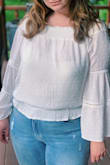 I wore this top for my elopement and engagement pictures. The sleeves were a little long and the top was a little sheer, but it was the perfect mix of casual and classy. - Tara S.