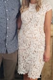 I wore this for my bridal shower. I got so many compliments! I originally got my usual size S but exchanged for an XS because it was definitely loose. The XS fit much better. The zipper did get stuck a bit and there are some loose strings due to the material. It also rubbed a little on the sleeve between my arm and side. Overall I would recommend. It's a great length for taller girls! - Charlotte C.