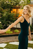 I love this dress! It fit perfectly with 3 inch heels. It was tighter than I thought it was going to be but it's so comfy I had to keep it. I wore it for my engagement pictures and will definitely be wearing it to future weddings! It feels a bit heavy on the hanger but it did not feel heavy while wearing it. - Bailey B.