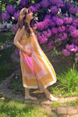 This dress is so unique. The material is so high quality and the wrinkles come out easily. It's a beautiful color and moves in a very interesting way in the breeze. It's so light and perfect for 80, 90 degree weather or hotter. - Natalia Z.