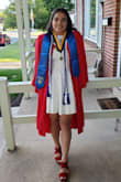 The graduation dress was beautiful when it came. It fit perfectly and fell above my knees at perfect length. The only criticism I would say is the top part looked a little weird and it felt like it need something there so I wore a black sports bra under to make it look better. I recommend adding a belt if you wear the dress by itself, because it could look plain. If you're wearing the dress to graduation then I would say to not wear a belt because you're already having your cap and gown on. - Kiarra D.