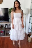 I was looking for a wedding dress to wear for my quarantine wedding. I wanted something simple but that still screamed bride. This dress was perfect for me! The fit is true to size, especially in the busy area. I got so many compliments. It is a little transparent but nothing nude I undergarments couldn't fix. I'm totally in love with this dress! - Bianca V.