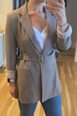 This blazer is super cute, but after reading the reviews I decided to size up to a medium from my usual small, which I kind of regret because it's a little big. Instead of returning it I just rolled up the sleeves and think it looks super cute! - Sarah T.
