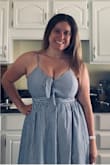 I ordered this in a large after reading reviews and fitting. Normally I am either a medium or large depending on fit due to bust. It fits perfectly and I was actually able to wear it without a bra which is unusual for me. Very pretty! - Tracie M.