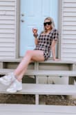 A little right on my bust, and yes like a lot of the reviews it runs a little short. I'm very leggy and noticed this but it's not too bad and absolutely do-able. Cannot wait for let this roll over and style for fall and winter with different looks! - Shay R.