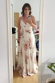 That dress is incredible! It's super comfy, material is of good quality, great lining, There's even a button to clip at the front for less cleavage. Unfortunately I had to move the button down a bit, but at least it was there! 
If I wanted to wear it for an event I would have to wear heels because it's a bit long, but I wore it for my engagement shoot and it was just perfect! I will post pictures when I receive them :) 
I recommend !! - Alexandra C.