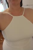 Unfortunately, my hips are much larger than my bust. I should have ordered for hips and taken it in up top. I ordered to fit overall and the dress was too tight in the wrong places. Otherwise, I loved the dress. Classy white high neck and comfy fabric. Note: the website pictures don't really show it but the slit goes right up the middle of your legs. - Kelly S.