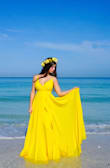 The dress fit perfectly and has a soft material. The color is bright and beautiful. Perfect for the beach photos I took. Very happy and I do recommend it. - Yuleidy B.