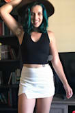 Bought this to wear with the white/black Lulus skort (seen in photo) and it goes perfectly! The top is thick, lined so you don't need a bra but the straps and back could definitely conceal a bra. Also, the front doesn't go as low cut as the sale picture makes it look. No fear of pop outs!
I love this so much I've already ordered the same top in a new color and will probably order even more! - Jacqueline G.