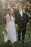 Absolutely perfect!! I panicked when my big wedding was postponed due to COVID-19 and I wouldn't be able to wear my original wedding dress for our new 10 person ceremony. I searched everywhere online for a white dress that still felt bridal. True to size. It was way too long so I did have to get it altered. It was kind of tight around the rib cage, there is no give with the middle band. But I felt comfortable the entire day. I would definitely recommend this dress. - Kayla D.