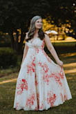 I was looking for a nontraditional wedding dress to wear for my Belize wedding, when I ordered this one. Then 2020 had no chill, and we ended up reorganizing the ceremony to my not-Belize backyard! This dress was absolute perfection and I received tons of compliments on it. The material is high quality with a really nice, silky lining that almost feels heavy on the hanger but didn't feel heavy wearing it. There is a small clasp at the bust but I removed that and used a safety pin, along with some dress tape to keep things family-friendly up top, haha! The wrap design makes things easy to adjust for sizing, and I had no worries about the side slit revealing anything. Just a gorgeous, elegant dress that beats more traditional wedding gowns, hands down! - Kristin R.