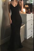 I love this dress! The material is nice and thick without feeling too heavy. The straps are adjustable which is amazing! The back comes down just far enough to cover a bra if needed. - Laynee A.
