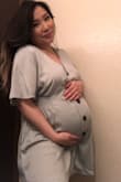 I bought a large thinking my belly would be too big but I could've gotten a size medium and it would've fit perfectly. This color is beautiful. In my pic the quality is low but you get the idea of how flattering and girly this satin dress is. Perfect for summer days! - Mai M.