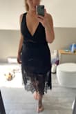 I have to say, I was most excited about this dress when I placed my order... what a disappointment. Material is poor, the inner lining shows beyond the seam where the lace starts, and it is flared at the bottom. I usually wear a Large, I sized up based on material, and it is still made to fit someone no bigger than a size 8. :( - Andria S.