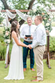 After having to postpone our original wedding and celebration a full year due to Covid, my fiance and I wanted to go on and get married with a "Corona Wedding" in his parents' backyard with just our families and a few close friends. I knew my original, very formal, wedding dress would be too much for a backyard wedding, but I still wanted to feel bridal AND comfortable/relaxed- and this dress was perfect for that! I ordered and tried on both a S and an XS, which were delivered quickly and returned seamlessly. While the S fit okay, the top was a bit too baggy and looked bunched once we got the corset-style back tightened (I'm also not well endowed up top, so I couldn't fill it out. The XS top fit perfectly (I did use sticky boobs just to help shape-wise) and though the XS skirt was a little snug, it was still comfortable and the waistband relaxed to fit perfectly after about 10 minutes. It was the perfect length too- just long enough to me a short train but still easy to walk in. LOVED my 'Rona Wedding Dress! - Madison S.