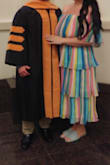 I wore this dress to my husband's hooding ceremony for his graduation. I received compliments all night long. Based on other reviews I ordered a M. The fit overall was great, a little small in the bust area but I have large boobs so I don't blame the dress. If I would've sized up I think the dress would have looked too big. - Melissa M.