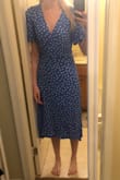 Dress is fitted and has a bright blue color. Comfortable, light fabric. Easy to dress up or dress down. - Ashley W.