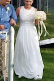 We had a small pop up wedding and thus dress was perfect for the occasion. I got so many compliments. I had to get about 4" taken off the bottom of the dress and a 1/2" on the top taken up. Dress was very comfortable. Had to wear a stick on bra. - Amanda M.