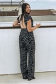 I really love this jumpsuit! I have a hard time finding jumpsuits that are comfortable and fit in a way that they aren't baggy and awkward in areas on my body. I got an XS rather than a S and was so happy I did. - Kayla Y.
