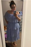 Definitely does not run big. The dress is meant to be flowy and pleated. I ordered a L (lavender) and XL (blue) and i liked the way the XL fit, way better! If you size down, you won't have have as many pleats. I ended up keeping the blue one. Lavender is pretty but a little more plain. - Crystal A.