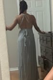 The fabric is soft and flows. The top is adjustable, the dress is beautiful. You can dress up or down, but very good quality. Shilling went smooth - Zella H.