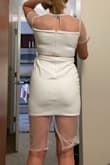 I bought a small and this dress fits really well! My only complaints are the arms are a touch tight, but I also don't have dainty arms. The other thing is the mesh on bottom is really weird. Looks good from the front but the back isn't quite right. I cut the bottom mesh off (with just a pair of kitchen scissors) like one of the other photos and love the dress. Plan to wear for my bachelorette party! - Brittany H.