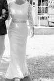 Fits very well. I am short, so a taller woman may not do well with the length if wearing heels. Love the open back. Beautiful, classy, not overdone. Perfect for an elopement ceremony. - Kellie M.