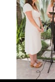 We had to postpone our big wedding day and decided to get legally married anyway. Since we are postponing I wanted to get a new dress that was simple but romantic. I saw this dress and ordered immediately! The dress itself is beautiful, the fabric is great and not see-through and is very flattering. The only down side is I have a short natural waist and the dress has a long waist. It did a bunch a little in the back but didn't stop me from feeling totally great all day. Really excited to wear this dress again and again - Crystal D.