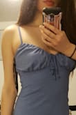 Probably one of the cutest and most flattering bodycon dresses. It fits a little loose so it doesn't show bloat but still hugs the curves nicely. I agree with the comments on how the bust is a little big  but if you adjust the ribbons you can make it look super flattering (I am between a C and D cup, so for smaller sizes it might not be the case). One thing that can help is wearing a bra with the dress so it doesn't look too loose. - Kristen L.