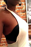 Granted the first time I wore it I messed up and used the wrong bra BUT it goes to show how tough it is to keep this top in place even if I had worn my stickies. That is a disaster waiting to happen. It is a ill fitting and I had to knot it well past the ribbon part to make it fit. - Sarah W.