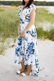 This dress is really comfy and moves beautifully when you walk. I had to wear a special low cut bra with it because the neckline is pretty low. The wrinkles steamed out easily.
I'm 5'6" and the dress just barely hit the floor in the back with flats on. I'm a size 6 in pants and I usually wear a size M in Lulu's. Because this dress is not fitted at the hips and because I'm smaller on top I decided to size down to a small. It fit nicely, just slightly looser than I would have preferred, but nothing requiring alterations. Would recommend it and would buy it again! - Christine G.
