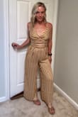 I love this jumpsuit, GREAT quality and fits beautifully!  True to size. I'm 5'1" and 110lbs, ordered XS. - Courtney C.