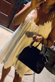I absolutely love this dress!  So cute and comfortable! I read the reviews before I ordered so I sized down and it for perfectly! - Lisa