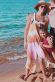 The dress is beautiful. I use it as a beach cover. It drops pretty far on the side so if you don't wear a bra you will have a lot of side boob. It also looks great with a tan - Jessica M.