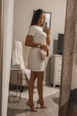 It's just perfect. I'm wearing a size Small and it fits perfectly, not too loose and not to tight just right. - Katherine T.