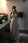 I bought this online in a size small for our small covid nuptial mass wedding ceremony! It runs long (I wore heels and it still dragged), but I didn't have time to get it hemmed. It fit beautifully in the chest and across my stomach. I wore a strapless bra with it. My family gave me tons of compliments! They all loved it and I felt beautiful. It was a perfect dress for our small wedding ceremony. - Lauren D.