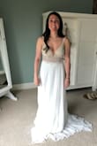 This dress was the bomb! I ordered it for a small elopement since my big wedding got pushed back. I did have to have a few things altered from being a typical petite size- which is normal for me. I had around 5-7 inches hemmed off and left some for a train and bustle. I had to have the straps shortened to stop the back from gapping, and I had bigger cups added because the ones in are for a smaller chested person. Honestly, if you have any sewing skills you could do it yourself. - Emily M.