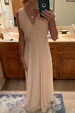 We ordered these for bridesmaid dresses for my friend's wedding. The model looks gorgeous, however as a short woman, my shoulder to bust space is shorter than most- which make straps very long on me. This dress did not have any boob padding and is very open in the front. When I tried it on originally, we (and the other girls) were worried about wardrobe malfunctions walking down the aisle. Even though I ordered an extra small, the top fit more like a medium on me and I don't wear medium. This photo is after shortening the straps, tacking the front, hemming the skirt (I'll wear heels the day of) and adding sports bra pads to avoid pointy boobs. Overall I was happy with the price and the effect after alterations, but I think it would work better off the rack on a different body type! - Christina M.