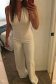 I ordered this for my bachelorette party which is going to be 70's themed. My fiancé dislikes pant suits/rompers but right when he saw me in it he told me how good it looked. I'm so excited to wear this! The material is thicker so it isn't see through. I also managed to wear a low pair or spanx underneath! - Hailey O.