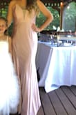This dress is so comfortable and flattering. I needed it for a small wedding that I had to wear a beige pink. I ordered it in M and L. I am so glad I got both because the large fit perfect. The material is not as formal as the picture. I was thinking it was going to be too dressy for being a wedding guest but it was not. Order it you will love it. - Julie P.