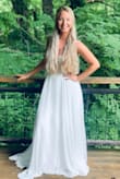 I bought this dress for my small, intimate mountain wedding. The 2 fit me perfectly without any alterations. I was also thrilled with the quality- the beading looks and feels very expensive, and the skirt is a lovely material. Felt like a woodland princess in the dress and got so many compliments. - Robyn W.