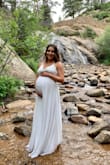 I bought this dress for my maternity photos. I ordered a size Medium based off reviews and description of the dress itself as I was 38 weeks pregnant when I wore this dress. I am usually an XS/SM depending on the fit. Overall this dress fit perfect and the straps were adjustable which helped a lot, I wore short heels and the length was great no need to hem. I would recommend to any mamas To-be or whoever wants a simple dress for photos. - Nora R.