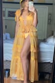 I love the sheer fabric and color of this piece. The material can look a bit cheaper if it is wrinkled. Once I steamed it, it looked gorgeous. From looking at the pictures provided, it seemed to be long so I sized down to an XS and it fits perfectly! - Renee K.