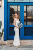 I had to get the dress hemmed at the bottom so it wouldn't drag on the ground, but other than that it fit perfectly! - Hali M.