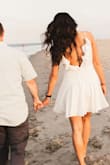 I wore this dress for some of my engagement photos and it was absolutely beautiful on. It was a little loose but not so much that I think I would want a small- I always run of the risk of smalls being too short on me. - Molly F.