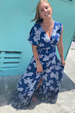 The dress was beautiful. I received many compliments. I hate dresses myself. I don't wear them unless the occasion calls for it. This occasion was family pictures on the beach. The dress worked out perfectly with my vision.
I sized myself the day I ordered the dress. Based on my measurements the website said I should have ordered a large. I have never bought a large in my life. So I decided to purchase the medium because I didn't want the small to be too small because I wouldn't have time for an exchange.
With it being a wrap dress I was able to tighten the dress enough so that it worked for me. It was way too long For my barefoot beach pictures but hey when I need to wear heels it would be perfect.
No beach photos yet. So here's the aftermath of my wet, salty, sandy dress. - Jenna L.