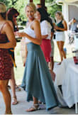 The skirt sits high on your waist and is very comfortable. Needs ironing a lot due to type of material. I received a ton of complements on it and I can't want to find something else to wear this too. The slit in the skirt is a nice added touch! Perfect for summer time! - Ashton H.