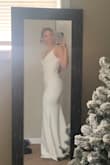 I almost want to return my original wedding dress. This was just one I wanted to change into! The material is thick and pretty stretchy. I ordered a small but received an x-small!!(or else 5 stars!) I didn't return it, it fit well! The chest padding is perfect I have no extra padding here! And some wiggle room for some cute heels! - Melanie M.